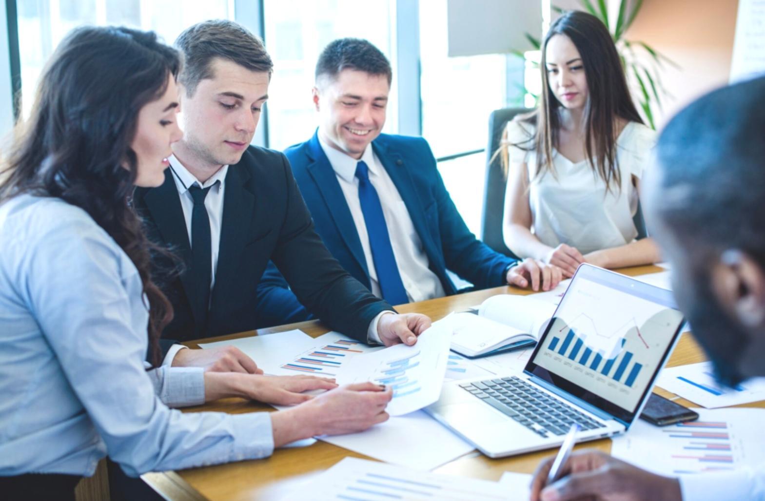 Business professional reviewing financial reports and data analysis